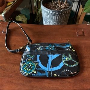 Wristlet / wallet by the brand MUDD with peace signs and flowers